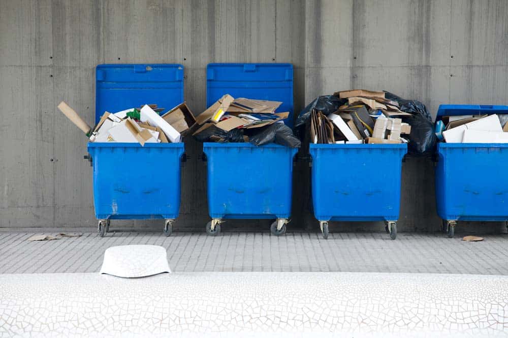 Dustbins full of discarded cardboard boxes